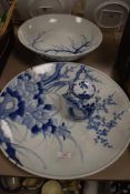 A 20th century large blue and white Chinese style platter and a bowl, having blue transfer