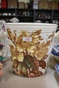 A late Victorian slop bucket, having floral transfer pattern, void of handle.