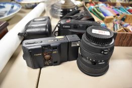 Two Canon cameras. A Canon Sureshot Multitele with Canon 35/60 1:3,5-5,6 lens and Canon MC with