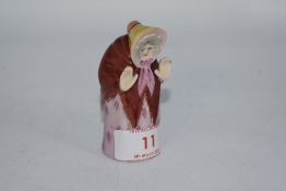 A Royal Worcester 'Granny' candle snuffer. AF.