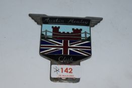 An Austin Healey Club car badge.