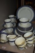 A Minton 'Mandeville' partial dinner service having cream ground with blue band and foliate details,