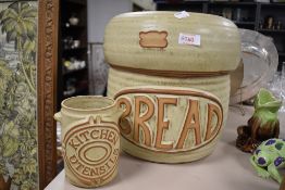 A mid century Tremar bread bin and utensil jar, inner bread bin lid having small chips to inner rim