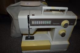 A Bernette sewing machine, with instruction manual.