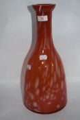 A Romanian art glass vase, having mottled red and white finish.