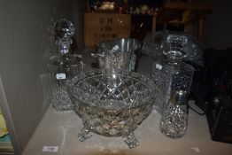 Two cut glass decanters and a sugar sifter, a pressed glass bowl and an ice bucket.