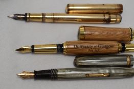 A Selection of fountain pens propelling pencils and ink. Two Parker Duofold, a Waterman 513, a
