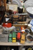 A miscellany of vintage items, comprising, vintage Dinky toys, coins, dominoes, wooden fishing reel,