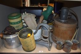 A collection of vintage kitchenalia, including enamel ware, utensils, jars, measures and more.