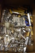 A box of mixed vintage cutlery, including bone handled knives.