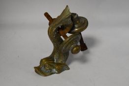 A vintage cast brass sea creature door knocker.