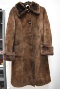 A vintage suede coat, unworn with original tags.