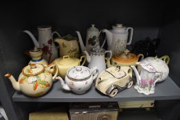 A mixed lot of vintage and antique tea and coffee pots, including novelty racing car, Beleek and