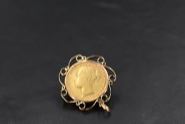 A gold sovereign dated 1872, in a 9ct gold pendant mount, approx 9.4g
