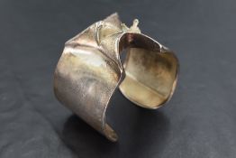 A silver Lapponia Man from Mercury cuff bangle designed by Bjorn Weckstrom of Finland, hallmarked