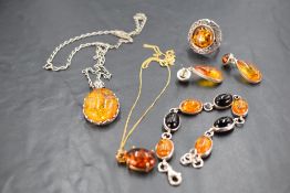 A selection of Baltic amber jewellery including dress ring, earrings, pendants, bracelet etc