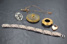 Six pieces of white and yellow metal jewellery including padlock clasp, filigree bracelet