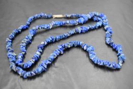 A long string of rough cut lapis lazuli, approx 32'