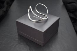 A Danish silver infinity bangle by Georg Jensen no: 452A, with original case & box