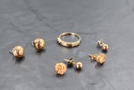 Three pairs of gold and yellow metal presumed gold stud earrings including spherical and knot