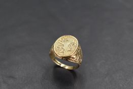 A gent's 9ct gold signet ring bearing a lion's passant to embossed shoulders, size P & approx 4.2g