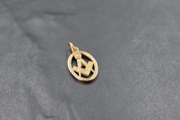 A 9ct gold Masonic pendant, of oval form with typical compass and square motif, marked 375, 2.