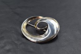 A Danish silver 'Continuity' brooch by Georg Jensen no: 443 designed by Vivianna Torun