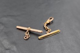 A 9ct gold T-bar, marked 375, 3.6grams, sold together with a yellow metal watch suspension, unmarked