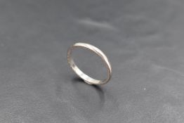 A platinum wedding band of plain form, size O/P and approx 1.8g