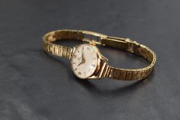 A lady's 1960's 9ct gold Omega wristwatch no:18770945 having baton & Arabic numeral dial to