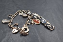 A silver charm bracelet having padlock clasp and ten charms, and a Siam bracelet having eight