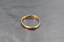 A 22ct gold wedding band, damaged, 1 gram
