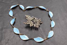 A Norwegian silver and turquoise enamel leaf necklace by David Anderson and a white metal foliate