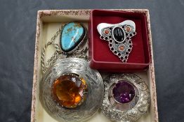 A small selection of silver including Scottish brooches, a Spanish jet brooch, turquoise pendant