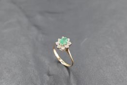 A chrysoprane and cubic zirconia cluster ring having knife blade shoulders and a 9ct gold loop, size
