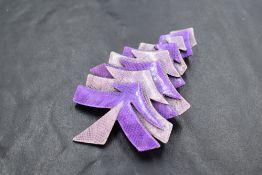 A Lea Stein of Paris laminated celluloid Christmas tree brooch in shades of purple
