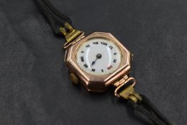 A vintage 9ct rose gold wrist watch having Arabic numeral dial with gilt minute dots to white dial