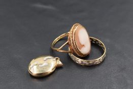 Three pieces of 9ct gold jewellery including footprints locket, cameo ring and eternity ring (AF)