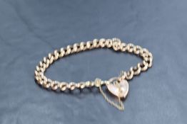 A 9ct rose gold curb link bracelet with padlock clasp, AF, approx 10.1g
