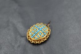 A small yellow metal pendant having turquoise stone decoration, no marks but tests as 18ct gold,