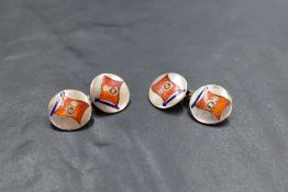 A pair of 925 grade white metal and enamel cuff-links, of circular form and enamelled with a red