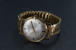 A gents yellow metal cased Rotary wristwatch, thought to be gold, the champagne dial with baton
