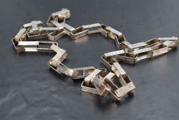A 1970's silver oversized link chain by Graham Watling having brushed detail to rectangular links,
