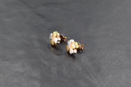 A pair of 18ct white and yellow gold stud earrings modelled as four leaf clover leaves, approx 1.3g