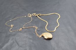 A 9ct gold bracelet and locket with chain, approx 3.3g