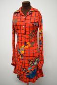 A 1960s jersey mini dress, having wonderful bright pattern on red ground, long sleeves and buttons