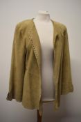 A 1990s Jean Muir beige Suede coat, having punched hole detail to hems.