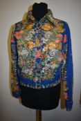 A vintage 1970s Liberty of London fabric jacket/blouse, having button down front with pockets to