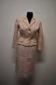 A 1950s Berkertex continentals pink and white candy striped two piece skirt suit.