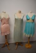 A trio of 1940s and 50s lingerie, including CC41 utility labelled slip in mint green.